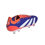 Championes de fútbol Adidas Predator Elite FG, color azul con detalles en naranja y blanco. Presentan empeine HybridTouch 2.0 con inserciones de goma Strikeskin y suela Controlframe 2.0 para césped natural seco.