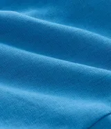 Blusa sin breteles color azul, con recortes delanteros, ruedo levemente abierto y cierre por cremallera lateral.