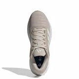 Championes de running Adidas Response Runner 2, color beige con detalles en blanco. Presentan un diseño de malla transpirable, las icónicas tres bandas laterales y una suela con amortiguación.