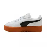 Championes urbanos Puma modelo Palermo Platform, color negro con franja lateral blanca y suela de plataforma color caramelo. Presenta detalles en dorado en la lengüeta y el lateral.