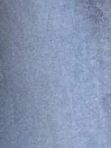 Pantalón de terciopelo azul grisáceo, de corte palazzo y tiro alto.