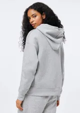 Sudadera con capucha de felpa, de corte holgado y diseño minimalista, con puños y ruedo acanalados.