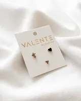 Set de tres pares de aros dorados de acero quirúrgico: un par con forma de cruz, un par con forma de corazón negro y un par con forma de triángulo.