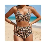 Conjunto de bikini de dos piezas de la marca Uniteduy, compuesto por un crop top amarillo liso con diseño cruzado y tirantes finos, y una bombacha de tiro alto con estampado floral y de hojas en tonos amarillos, verdes y blancos.