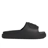 Sandalias Adidas Campus 00S Foam Slide de color negro, confeccionadas en una sola pieza de espuma moldeada, con suela dentada y tira ancha superior con el logo de la marca en relieve.