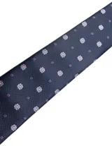 Corbata de seda azul marino con estampado paisley en tonos rosados y blancos.