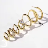 Par de aros tipo argolla dorados, de acero con baño en oro de 18k.