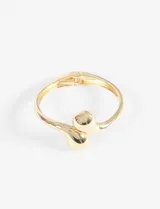 Pulsera tipo cuff de metal plateado, con diseño abierto y extremos terminados en formas esféricas o de gota abultada.