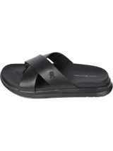 Sandalias Tommy Hilfiger negras con tiras cruzadas y logo de la marca en la tira superior.