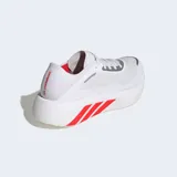 Championes de running Adidas Hyperboost Run color blanco, con suela gruesa y detalles en rojo brillante en las tres tiras laterales.
