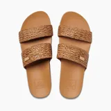 Sandalias de mujer Reef Cushion Vista Braid color tostado, con doble tira ancha de tela trenzada y placa metálica con logo grabado. Presenta una plantilla acolchada de alta comodidad con soporte para el arco.