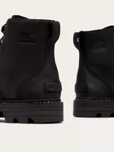 Bota de caña media Sorel, confeccionada en cuero negro con costuras selladas impermeables. Presenta cierre con cordones, ojales metálicos, suela de caucho EVERTREAD™ con diseño dentado y logo de la marca grabado en el lateral.