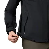 Campera impermeable Columbia modelo Earth Explorer II, color negro, con tecnología Omni-Tech, costuras selladas, capucha ajustable, ventilación en axilas y cierre frontal con solapa.