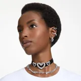 Par de aros tipo argolla Swarovski modelo Matrix, con forma de corazón y engaste pavé de cristales transparentes talla baguette sobre base con baño de rodio.