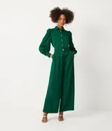 Pantalón pantalona verde esmeralda de jacquard con botones diferenciados en la cintura.