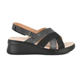 Sandalias negras con plataforma, tiras cruzadas y ajuste con velcro en el tobillo.