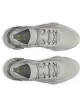 Championes de entrenamiento Under Armour modelo Halo Trainer, color gris con detalles en amarillo neón y estampado animal print en el talón. Presentan amortiguación reactiva UA HOVR, parte superior ligera con perforaciones para ventilación y suela de goma con ranuras de flexión para mayor tracción.