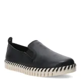 Zapatos tipo slip-on de cuero negro con diseño de textura granulada. Presentan una suela de goma blanca con detalle de costuras decorativas en contraste a lo largo de todo el borde.