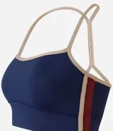 Top deportivo Get Over con diseño de espalda nadador y breteles finos en color beige contrastante. Confeccionado en microfibra técnica, cuenta con copas incorporadas para mayor sujeción y ajuste al cuerpo.