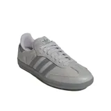 Championes Adidas Samba Og color gris con las tres tiras características de la marca en gris oscuro.