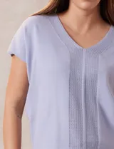 Buzo tejido color blanco, marca Ninety. Escote en V. Calado en escote y delantera.