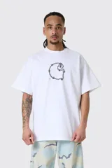 Remera blanca Carhartt WIP de manga corta y corte holgado, con estampa frontal en negro con diseño de alambre de púa formando la letra C.