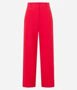 Pantalón de sastrería corte wide leg, de tiro alto con cintura doble y detalle de remaches metálicos en la parte frontal.