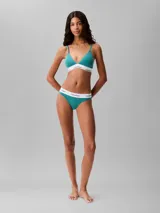 Colaless de algodón modal color verde azulado, con cintura elástica blanca con el logo de Calvin Klein repetido.