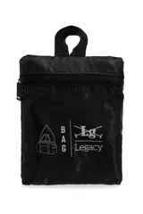Bolso de viaje plegable azul marino con asas de mano y correa ajustable para el hombro en color celeste, featuring un bolsillo frontal con cierre y parche de la marca Legacy.