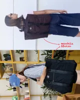 Bolso tipo tote de diseño urbano, confeccionado en material impermeable acolchado de color negro. Cuenta con doble asa de hombro, compartimento principal con cierre, bolsillo frontal con cierre y detalle de logo circular en la parte superior.