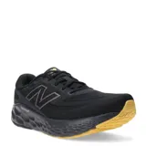 Championes de running New Balance modelo Evoz V4, con capellada de malla técnica negra y entresuela Fresh Foam X de color negro. Presenta suela de goma en tono amarillo y logo lateral característico de la marca.