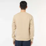 Buzo de cuello redondo en felpa perchada, con diseño liso, mangas largas y puños acanalados.
