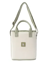 Matera modelo Cadiz con diseño a rayas en tonos beige, blanco y marrón, asas cortas de mano y correa larga ajustable para el hombro.