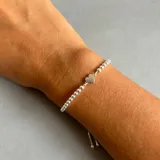 Pulsera de plata 925 con cadena de bolitas y dije de corazón.