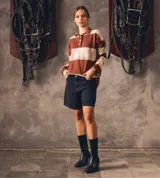 Botas de cuero negras de caña media con taco de diseño animal print.