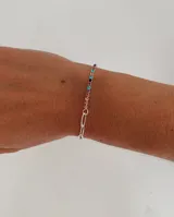 Pulsera de acero quirúrgico con diseño mixto que combina una sección de cadena de eslabones y una sección de strass multicolor.