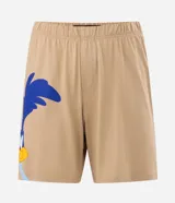Pijama corto de algodón en color beige, compuesto por remera de manga corta con corte boxy y gran estampa frontal del Coyote de Looney Tunes, y bermuda haciendo juego con estampado lateral.