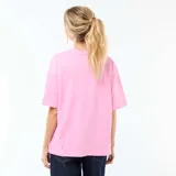 Camiseta de corte oversize color rosa, con cuello redondo y mangas cortas. Presenta un estampado frontal con la frase 'COSTA AZUL' en letras rojas y un diseño de sol, acompañado por la inscripción 'Palma de Majorque'.