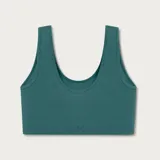 Top deportivo de tejido acanalado sin costuras, con escote redondo y diseño de espalda estilo nadadora. Ofrece un ajuste ceñido y soporte medio.
