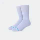 Par de medias deportivas naranjas con una línea azul en la puntera y logo de la marca en el tobillo.