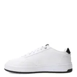 Championes Puma Court Classic de estilo urbano inspirado en el tenis, con diseño de líneas limpias y detalles en dorado. Presentan una parte superior de material sintético con perforaciones laterales para mayor ventilación y una suela de goma resistente.