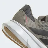 Championes de running Adidas Duramo SL 2, color verde oliva con tres franjas negras en el lateral. Presentan una mediasuela gruesa de amortiguación blanca con la inscripción 'LIGHTMOTION' y detalles en rosado en el talón.