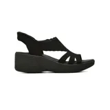 Sandalias Skechers Slip-Ins Parallel Lite de color negro, con diseño sin cordones, parte superior de punto elástico con detalles festoneados y suela de cuña con tracción.