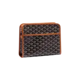 Bolso neceser Goyard modelo Jouvence MM, confeccionado en lona con el característico estampado Goyardine en tonos negros y marrones, con ribetes de cuero tostado y cierre superior con cremallera.