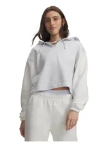 Buzo con capucha Under Armour modelo Rival Fleece Laceup, de color celeste claro con mangas texturizadas en tono gris melange. Cuenta con diseño crop, cordones cruzados decorativos en el cuello y puños y bajo acanalados.