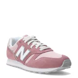 Championes urbanos New Balance modelo 373, confeccionados en una combinación de gamuza y malla en tonos rosados, con el logo 'N' característico en los laterales y suela de goma.