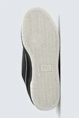 Zapatilla deportiva de estilo urbano con cordones, confeccionada en una combinación de piezas de cuero sintético. Presenta un diseño con detalles en contraste, suela con volumen bicolor y tirador en el talón.