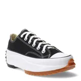 Championes de lona negra con plataforma blanca y suela dentada de goma en color caramelo. Presentan cordones blancos y puntera de goma reforzada.