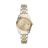 Reloj analógico Fossil con caja de 32mm, esfera color champán con índices de cristal y números romanos, y calendario. Presenta un diseño bicolor en acero inoxidable plateado y dorado con bisel estriado.