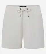 Bermuda masculina tipo runner de terciopelo cotelé, color beige, con cintura elástica, cordón ajustable y bolsillos laterales.